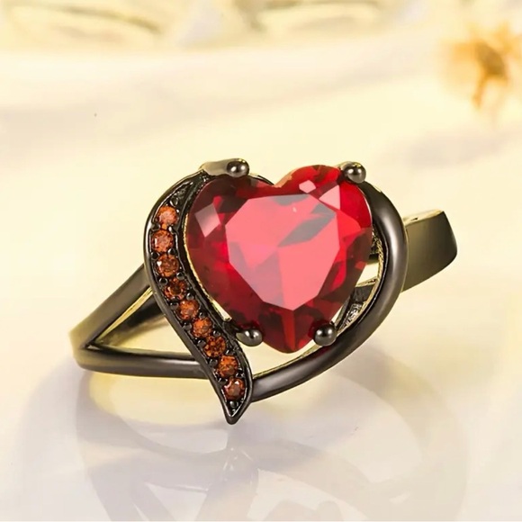 Anthropologie Jewelry - Black Band Ring with Red Heart Gem.